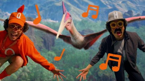 Two versions of Andy Day, wearing caps with 'Q' and 'H', rapping to the camera, with a pterosaur behind.
