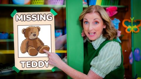 Miss Hoolie in the Balamory Nursery, pointing to a poster showing a Missing Teddy.