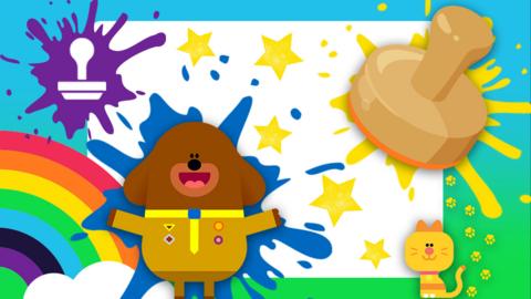 A large stamp splat, yellow paint stamps in star-shapes on a canvas. Hey Duggee and Enid the yellow cat smiling and making a mess.