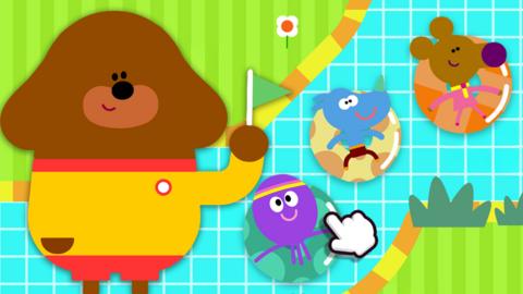 Image of Duggee holding a green flag next to a swimming pool with the Squirrels floating in rubber rings.