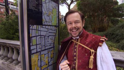 Shakespeare looking at a map