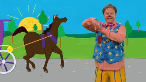 Mr Tumble and a horse and carriage