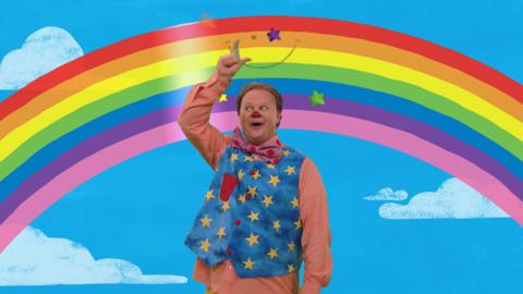 Mr Tumble and a rainbow