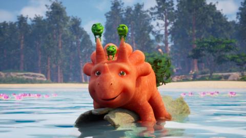 Pea-Rexes sat on top of Ginger's head who is riding a log in water.