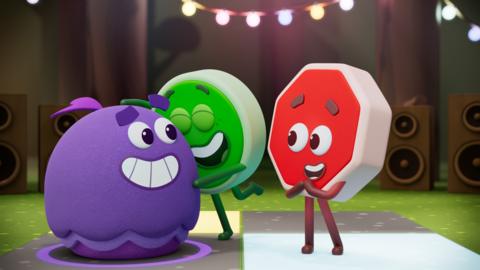 Go hugs Arty, a large purple blob, whilst Stop cheers.