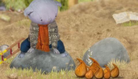 Abney sitting on a rock looking at the Poc-Pocs