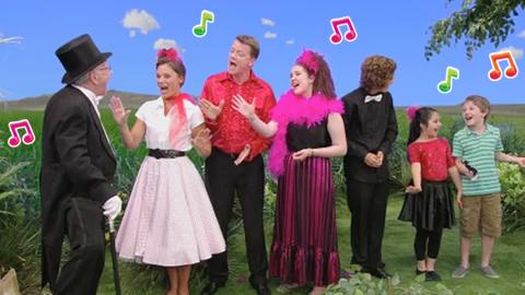 Cheery Charlie sings in the meadow.