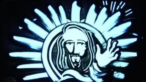 Sand drawing of Jesus
