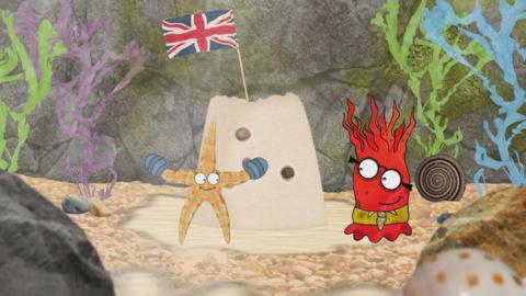 Sally the starfish and Andrew the anemone from Old Jack's Boat: Rockpool Tales in front of a sandcastle with a flag on it.