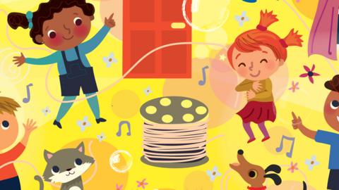 A group of children smiling and dancing around a bobbin