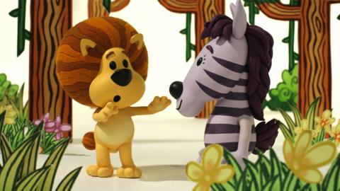 Raa Raa the Noisy Lion waving his arms at Zebby in the Jingly Jangly Jungle.
