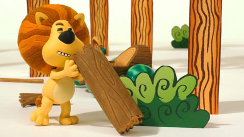 Raa Raa the Noisy Lion sharpening his claws on a scratching post.