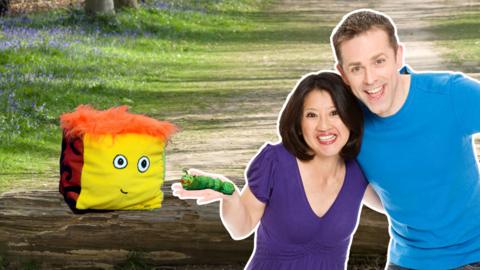 Stuffy, Colin the Caterpillar being held by Pui and Chris in the park.
