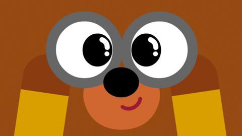 Close up of Hey Duggee holding binoculars to his face