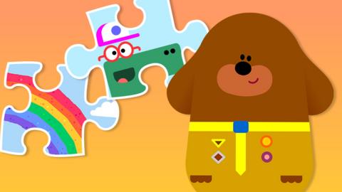 illustration of duggee next to two jigsaw pieces.