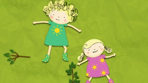 Nelly and Nora lying on grass