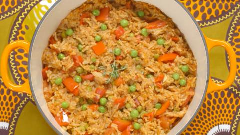 Vegetable jollof rice in a wide casserole dish.