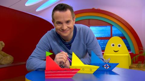 Alex with his paper boats