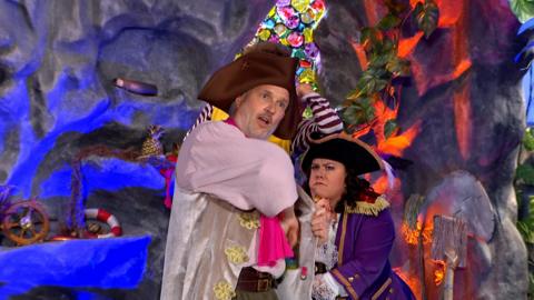 Sandy reaching into his waistcoat pocket