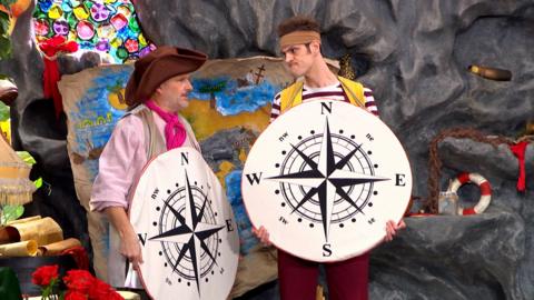 The pirates are holding big compasses