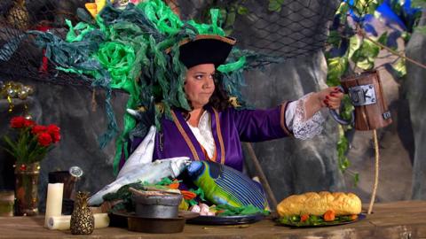 Captain Captain covered in fish