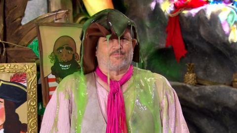 Sandy has slop all over him.