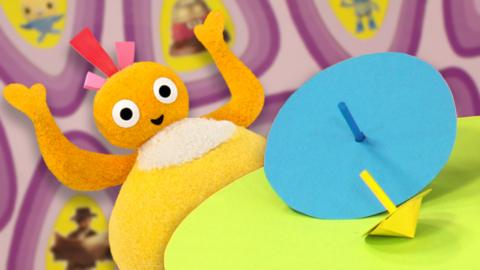 Twirlywoos playing with a twirler.