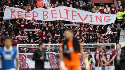 Hearts fans display a banner reading "keep believing" in the stands after the victory over Rangers on 4 May