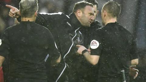 Ian Evatt speaks to the referee Ross Joyce