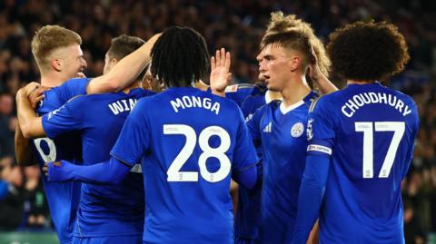 Leicester players celebrate the goal against Wrexham