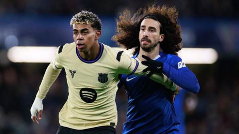 Lamine Yamal and Marc Cucurella challenge each other.