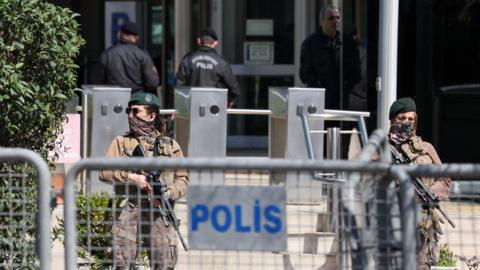 Two Turkish Police's special forces stand guard holding rifles