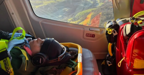 A young boy inside a helicopter