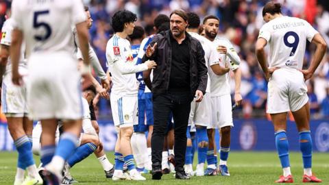 Leeds United manager Daniel Farke shakes the hand of Ao Tanaka of Leeds United during the Emirates FA Cup Semi Final match between Chelsea and Leeds United.

