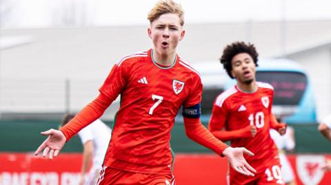 Oliver Bostock celebrates scoring for Wales Under-17s