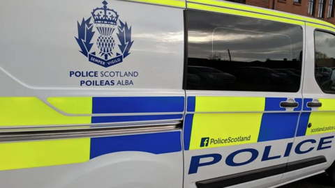 the side of a marked Police Scotland van