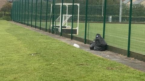 Rubbish left behind at Ysgol Alun and Ysgol Maen Garmon's campus