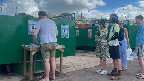 People in a queue for the water supply