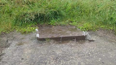 Sewage water flowing from a manhole cover at the end of the Lower Promenade at Saltburn