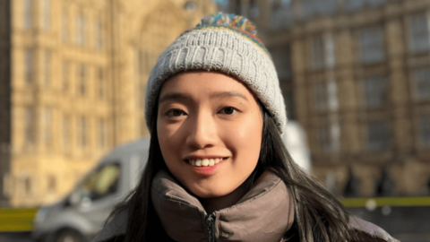 Chloe Cheung in front of the Houses of Westminster