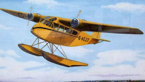 A painting of a yellow seaplane in flight