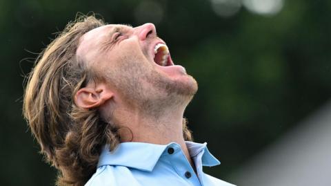 Tommy Fleetwood lets out a roar of delight after winning the Tour Championship in Atlanta