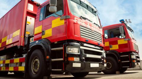 Two fire engines parked side by side