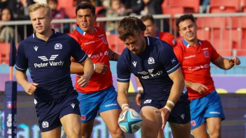 Kyle Rowe scores a try for Scotland against Chile