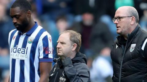 West Brom defender Semi Ajayi walks off after suffering a hamstring injury against Oxford United