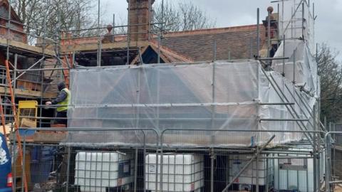 A library building with scaffolding on it