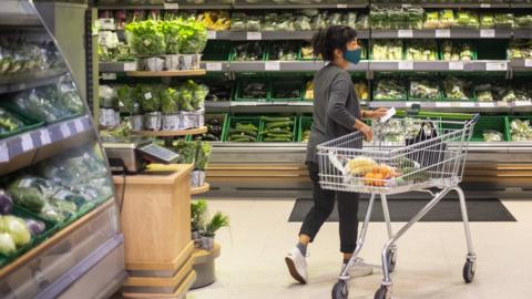 Woman shopping in supermarket