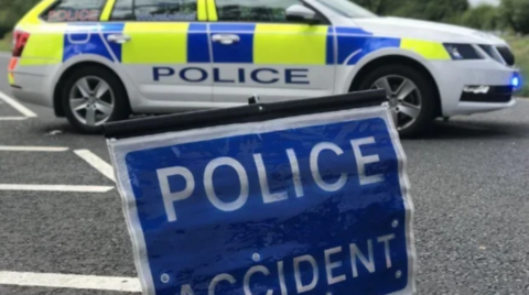 Generic Image of a police car and road sign which reads "police accident"