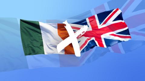 the national flag of ireland alongside the union jack of united kingdom with a white cross in the centre. against a sky blue background. both are flying like in the wind