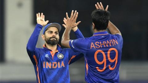 India's Virat Kohli and Ravichandran Ashwin celebrate a wicket in the ICC Men's T20 World Cup game against Namibia